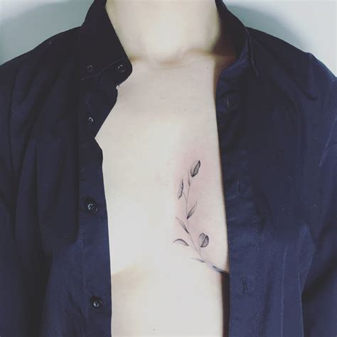 between chest tattoo female|In between chest tattoo for women